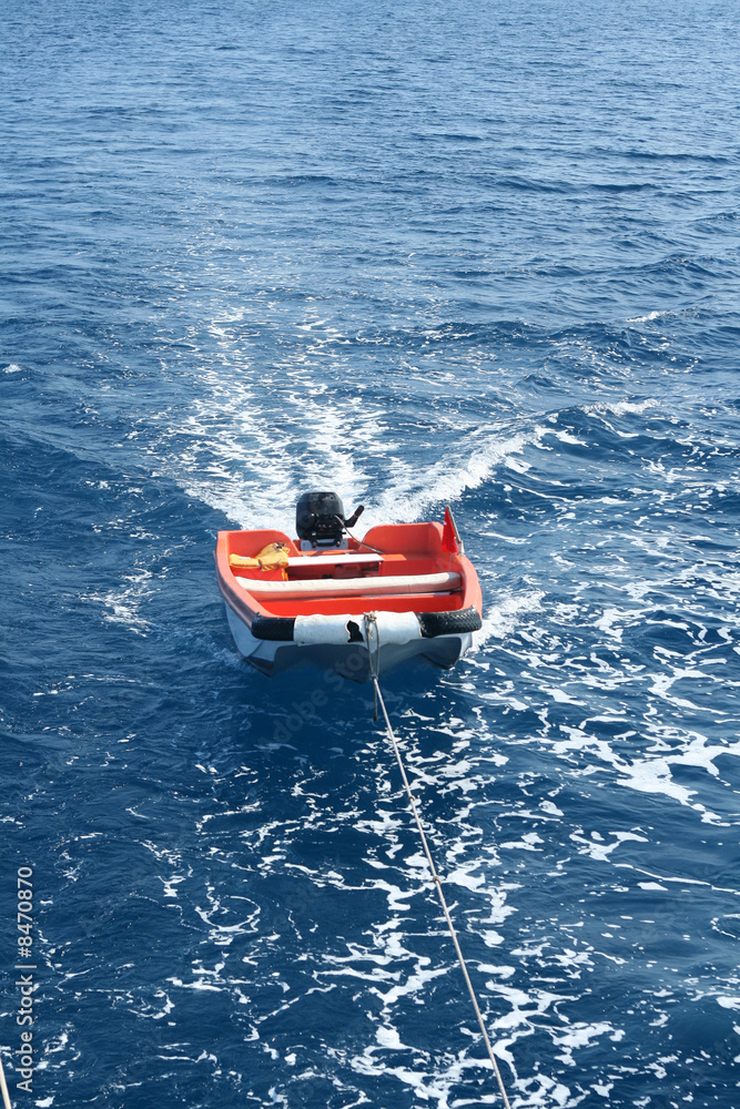 Fototapeta premium Boat is towing to harbour.