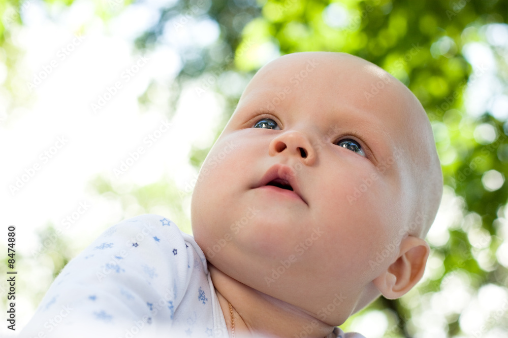 Baby in a summer garden Baby in a summer garden