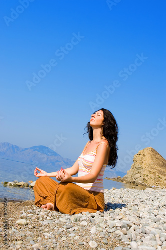 young woman meditation in the beach © Dmytro Sunagatov