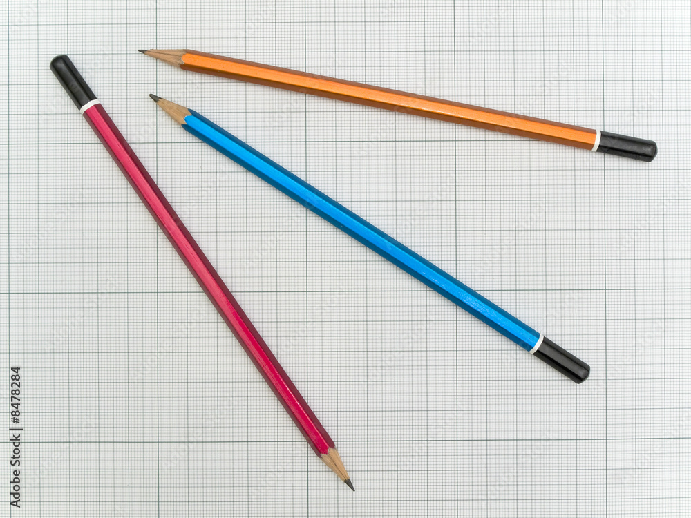 Three pencils at the plotting paper Three pencils at the plotting paper