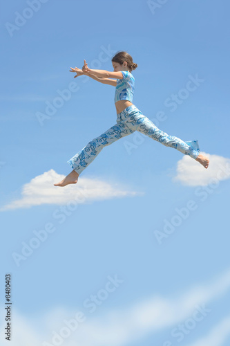 Beauty girl jump on sky clouds