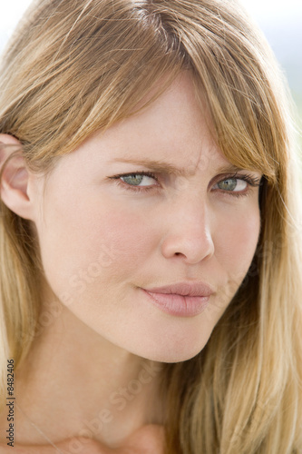 Head shot of woman scowling