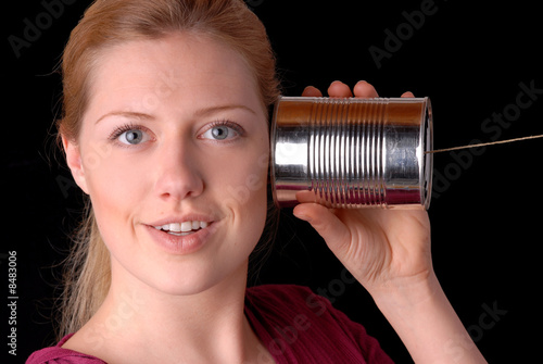 Frau mit Dosentelefon photo