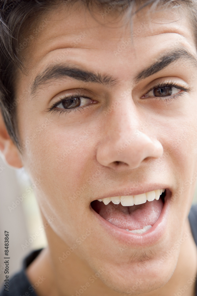 Head shot of man scowling