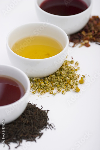 Three cups of tea in different colors with three different types
