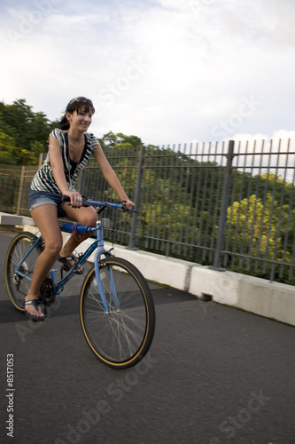 Fototapeta Naklejka Na Ścianę i Meble -  Girl Riding a Bike