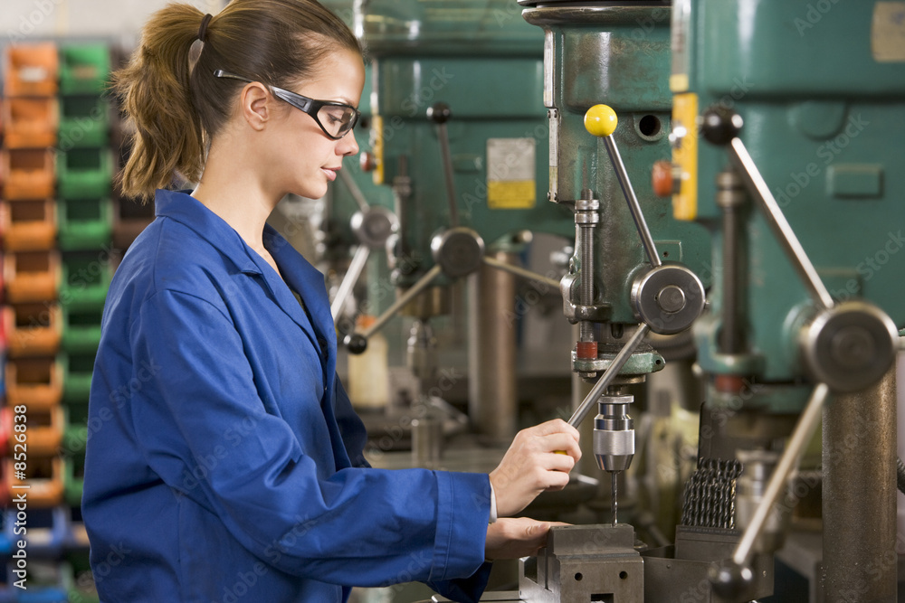 Machinist working on machine Machinist working on machine