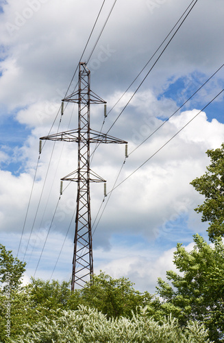 High voltage power line pillar on background a sky