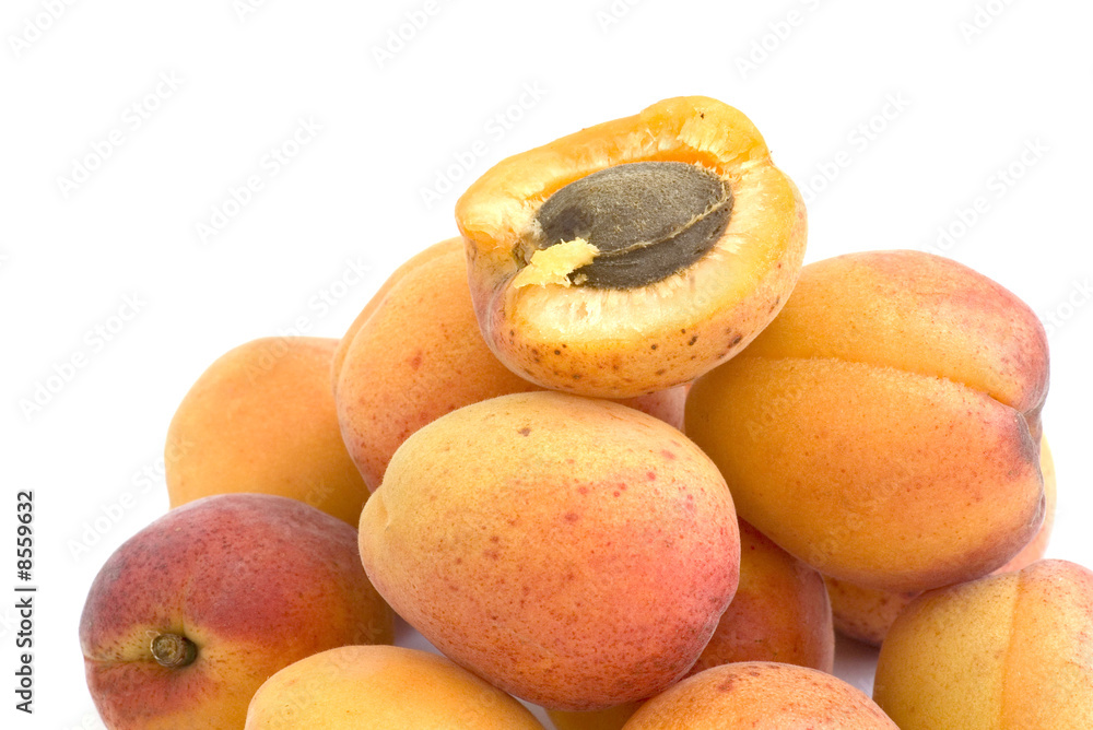 Fresh appetizing apricots on a white background