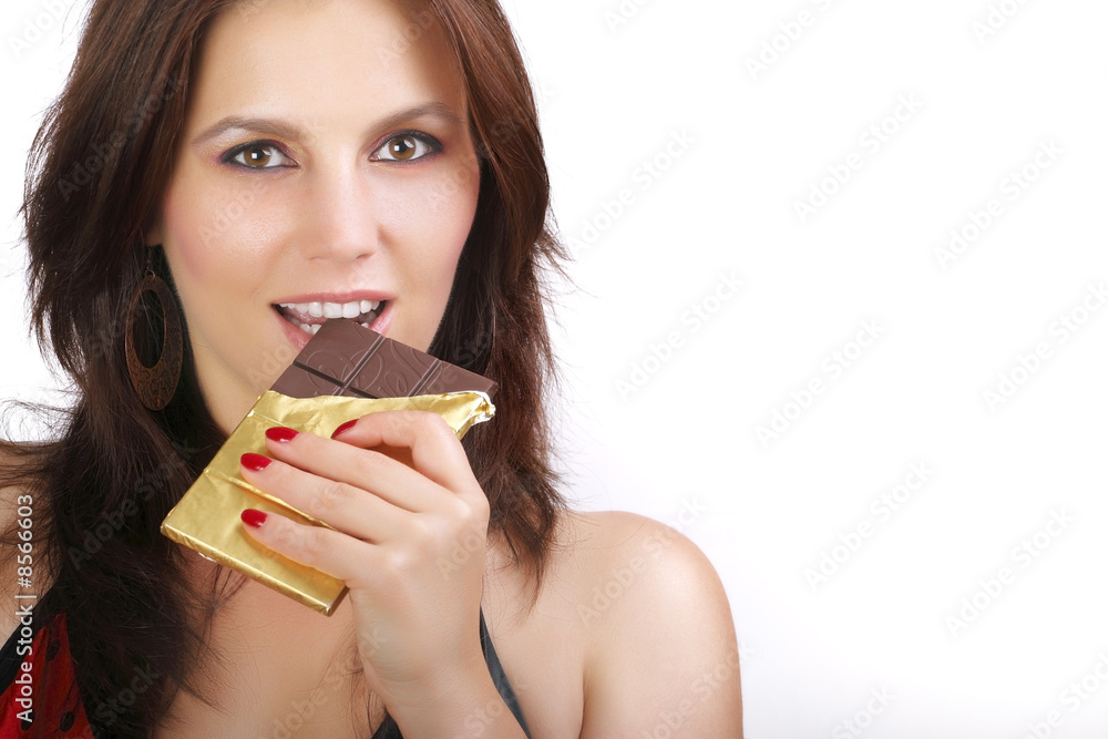 Beautiful girl eating chocolate,close-up