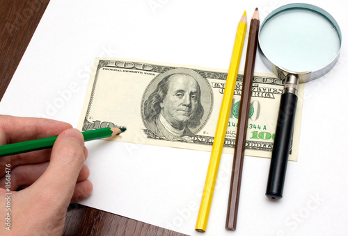 Someone draw dollar by pencils photo