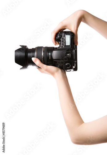 Fotografie Woman hands holding professional photo camera