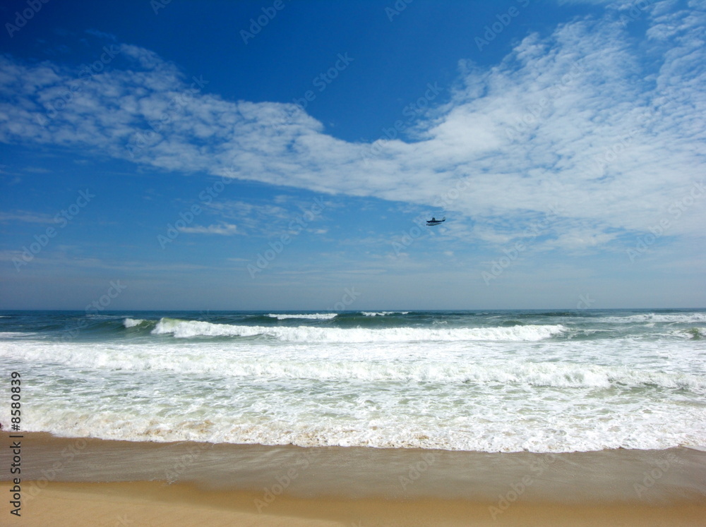 ocean beach with seaplane