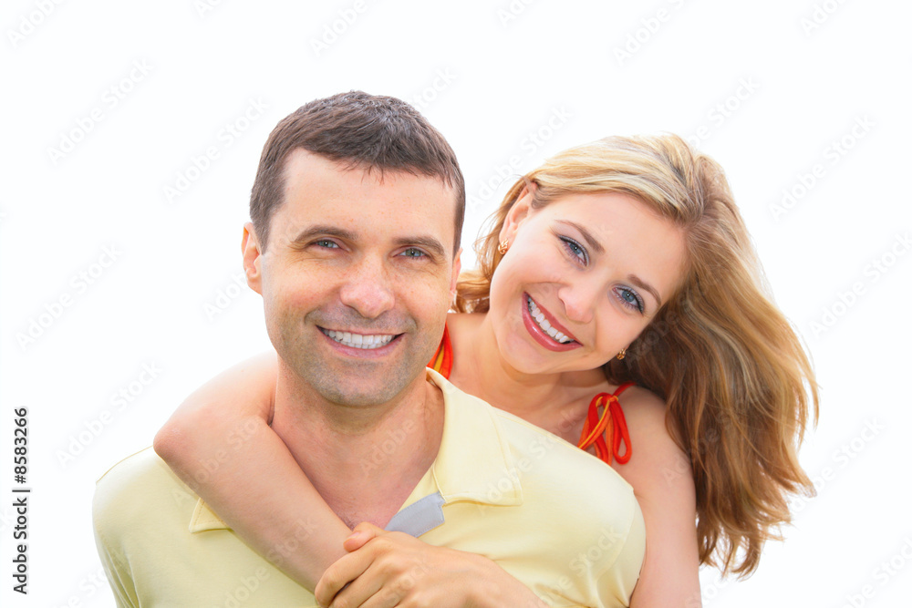 young woman embraces man behind