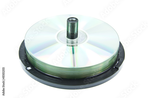 Colorful DVDs or CDs on spindle isolated on white
