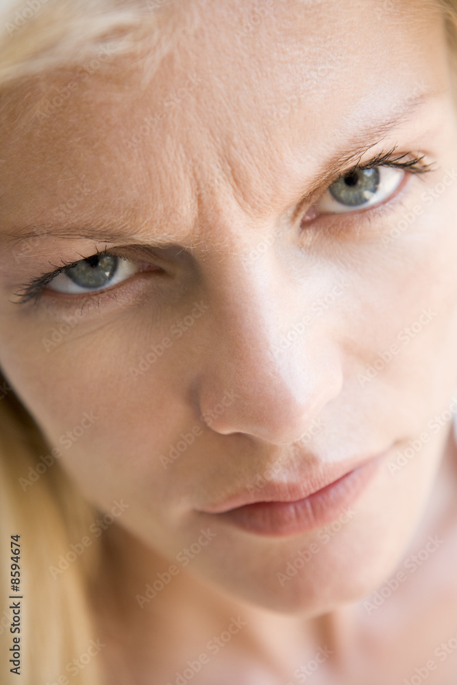 Head shot of woman scowling Head shot of woman scowling