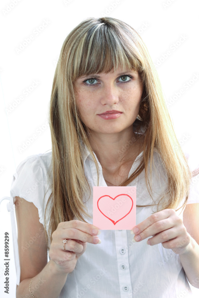 Young girl with romantic heart on note pad Young girl with romantic heart on note pad