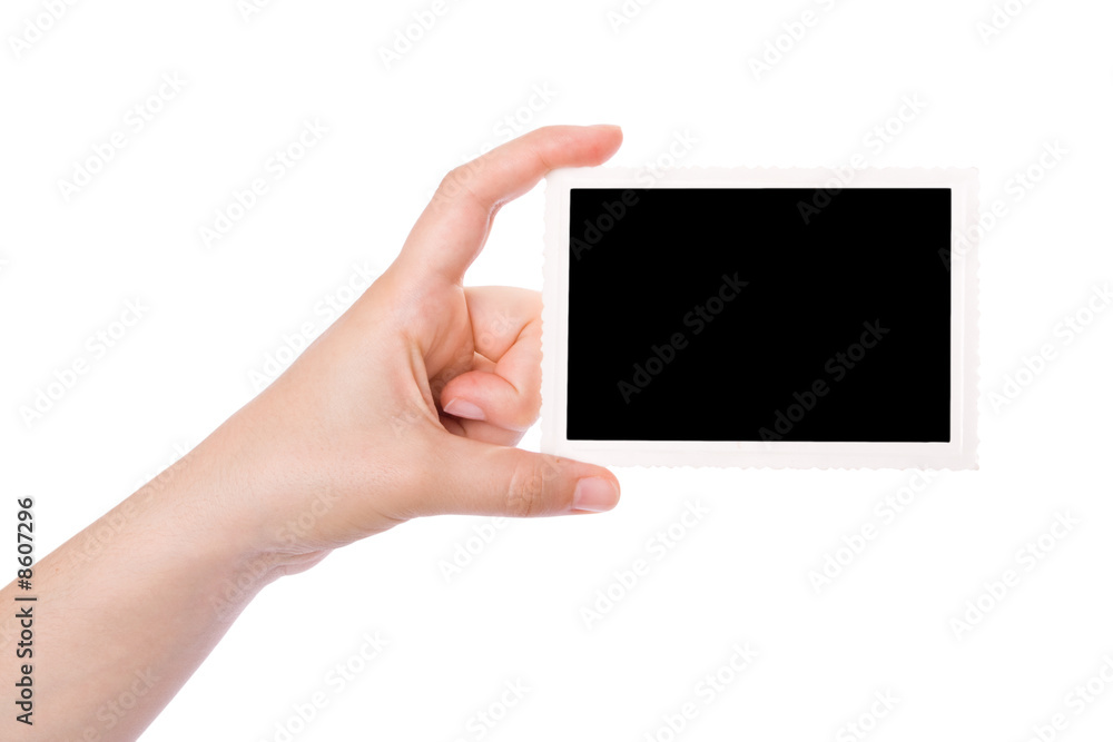 Hand holding a photograph isolated on a white background. Hand holding a photograph isolated on a white background.