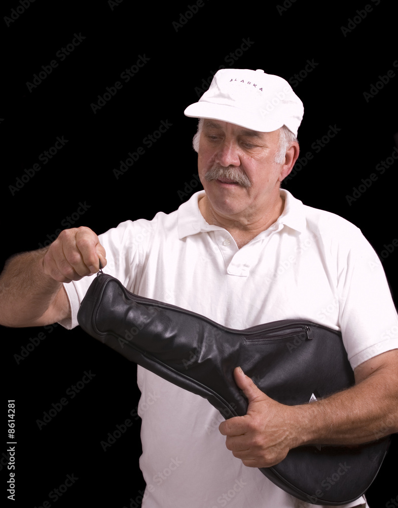 older man preparing to play tennis older man preparing to play tennis