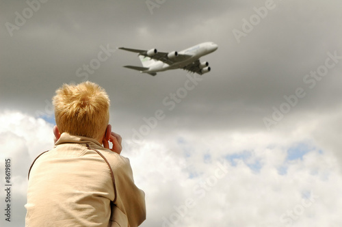 small child deafened by a low flying jet