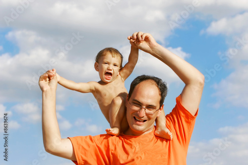 father and son on sky background