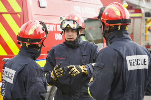 A firefighter giving instructions to his team