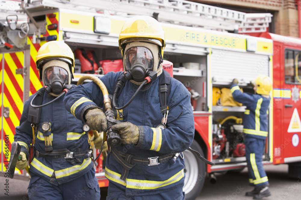 Fototapeta premium Firefighters in protective workwear