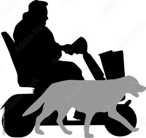 senior driving  mobility scooter  accompanied by his dog