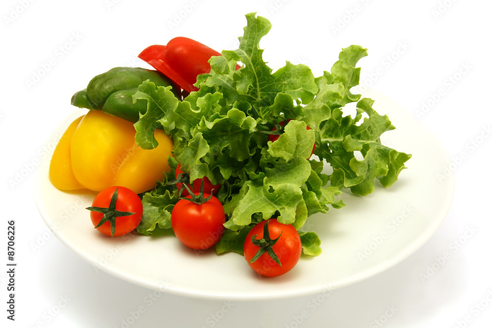 raw vegetables on dish isolated over white raw vegetables on dish isolated over white