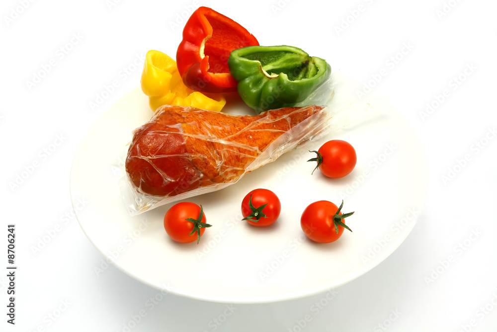turkey leg inside vacuum pack with tomatoes and pepper turkey leg inside vacuum pack with tomatoes and pepper