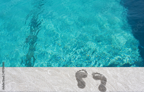 Feet by the swimming pool