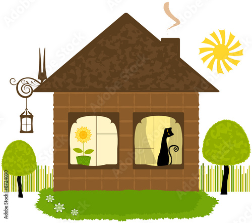 House with cat in window and trees in green yard