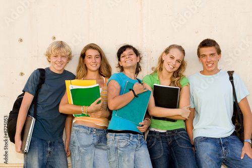 group of teens students hanging out at school