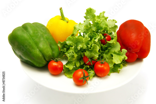 vegetables on white dish isolated over white