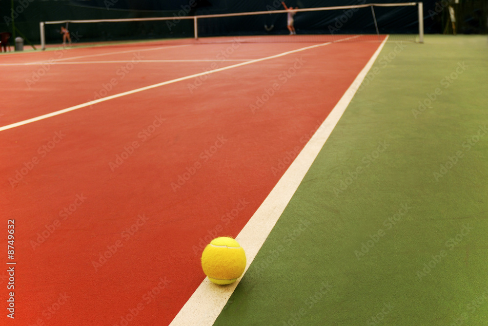 Tennis racket and yellow ball