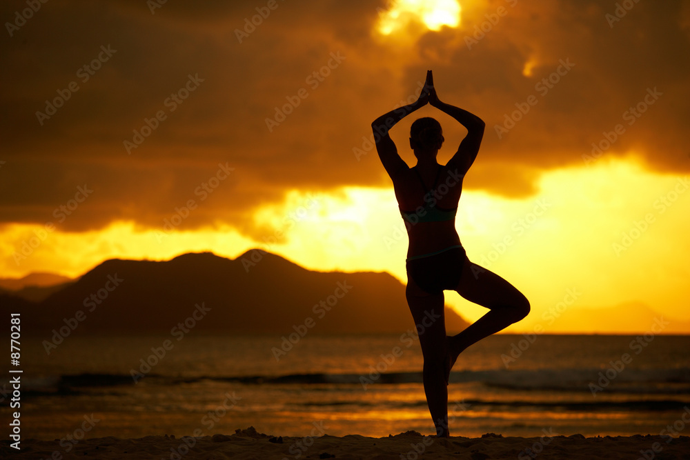 yoga in front of sunset