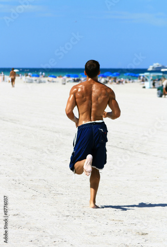 man jogging on the beach