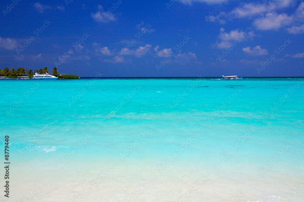 Sand beach and ocean vessels, Ari-Atoll. Maldives