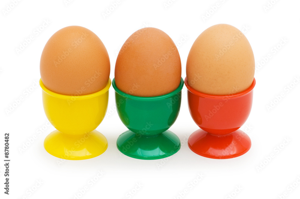 Brown eggs in holder isolated on white Brown eggs in holder isolated on white