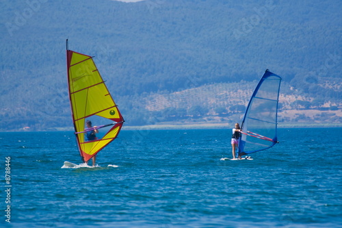 Sailing windsurfers Bracciano lake Italy