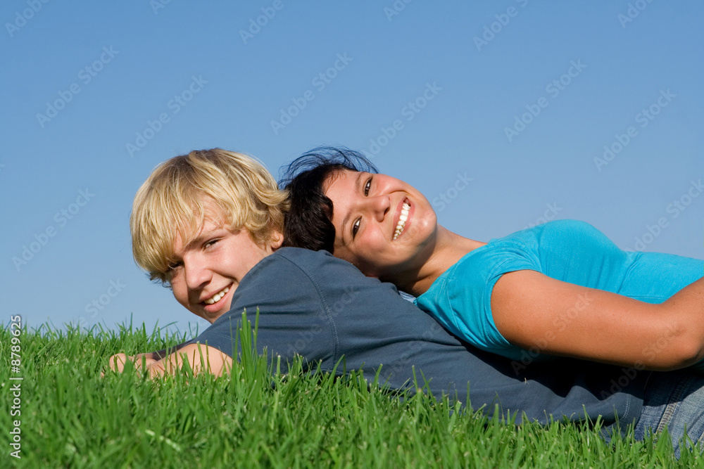 happy young couple of friends relaxing in summer happy young couple of friends relaxing in summer