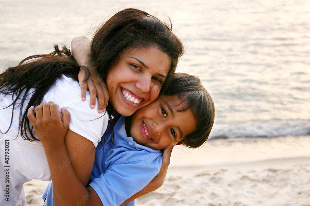 Mother Hugging Son Tightly on the Beach Mother Hugging Son Tightly on the Beach