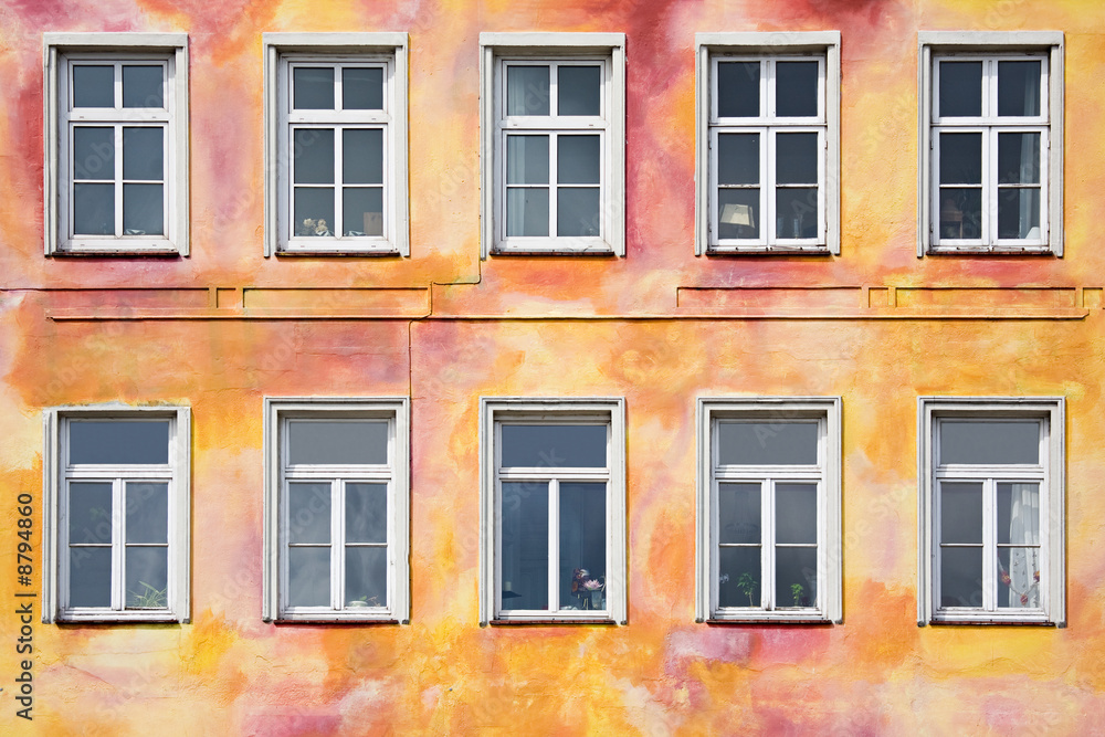 Obraz premium colorful old apartment front