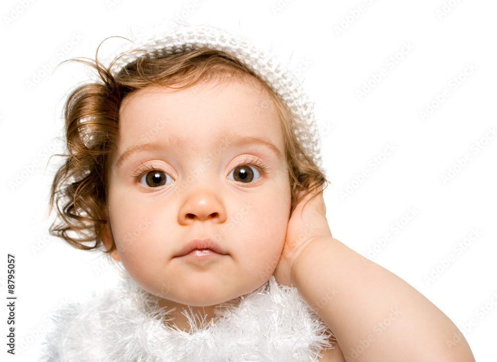pretty curly-headed baby girl in white dress and hat, isolated
