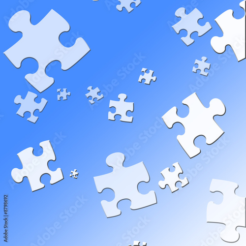 puzzle pieces on a soft blue background