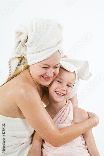 Young woman and little girl after the bath