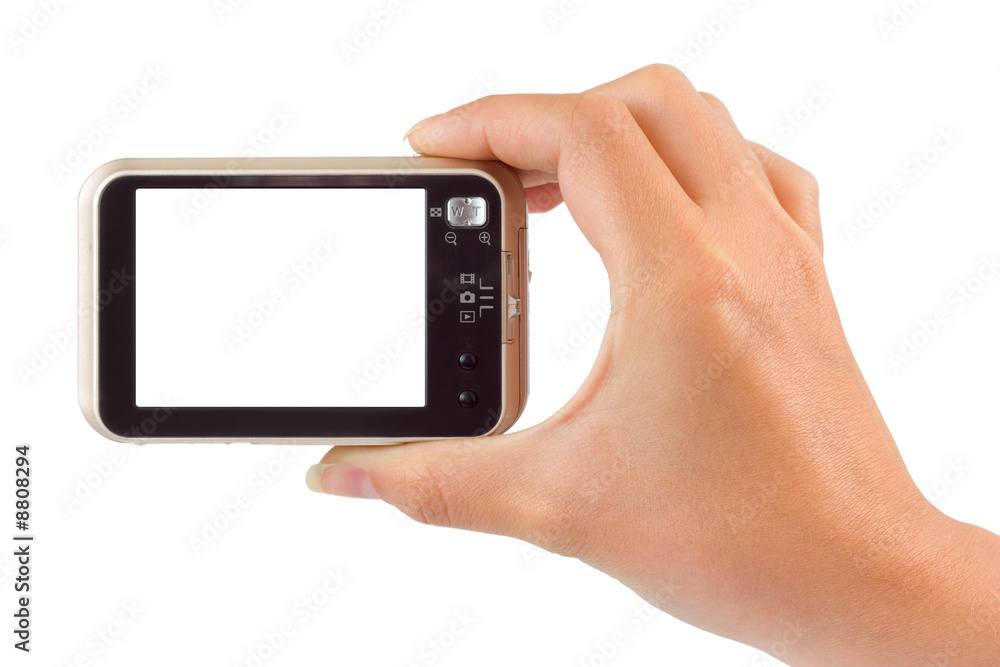Photo camera in hand isolated on white background Photo camera in hand isolated on white background