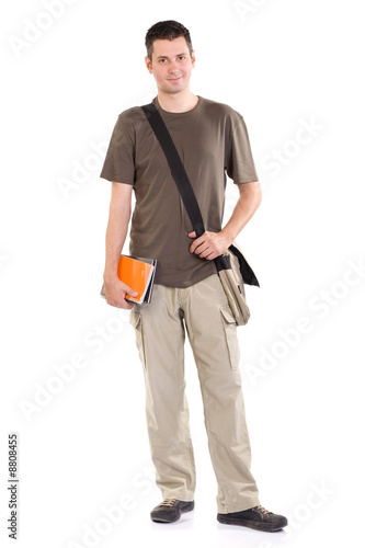 Young man standing with book and bag, isolated on white
