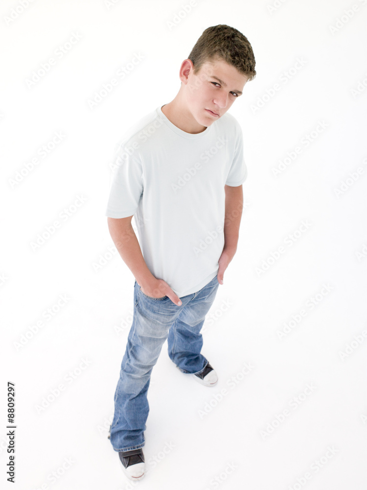 Teenage boy standing with hands in pockets Teenage boy standing with hands in pockets
