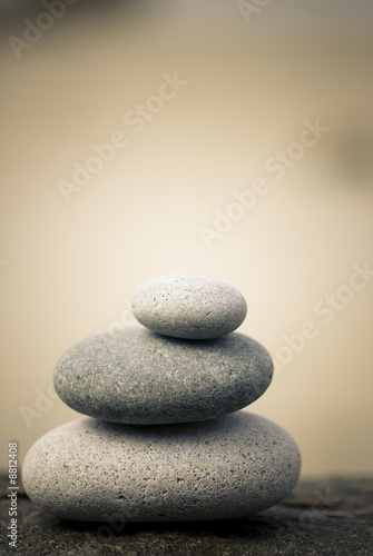 pebbles stacked on a rock background